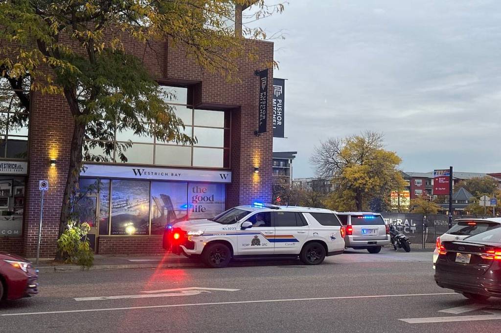 RCMP block alley ways downtown Kelowna, Saturday evening. (Brittany Webster/ Black Press Media)