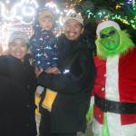 The Grinch poses with a family at the start of holiday celebrations in Langford&rsquo;s Veterans Memorial Park. (Ben Fenlon/Goldstream Gazette)