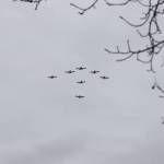 People looked to the skies as a flyover was done right over the parade route. (Brendan Shykora/Morning Star)