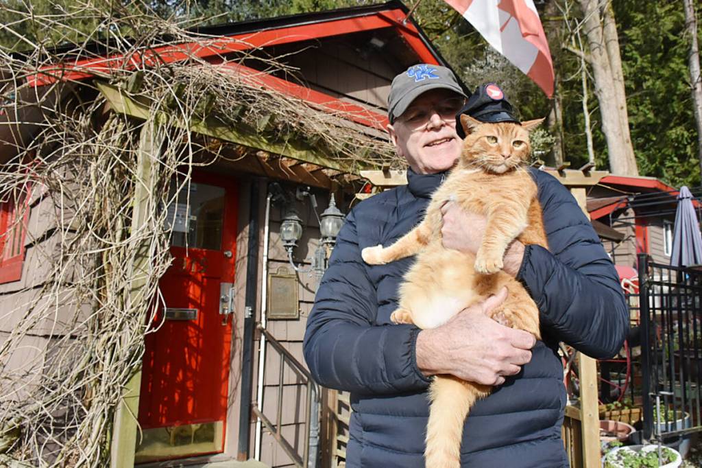 Whonnock resident Paul Stanley holds Sid, the honorary postmaster for the Whonnock Post Office. (Colleen Flanagan/The News)